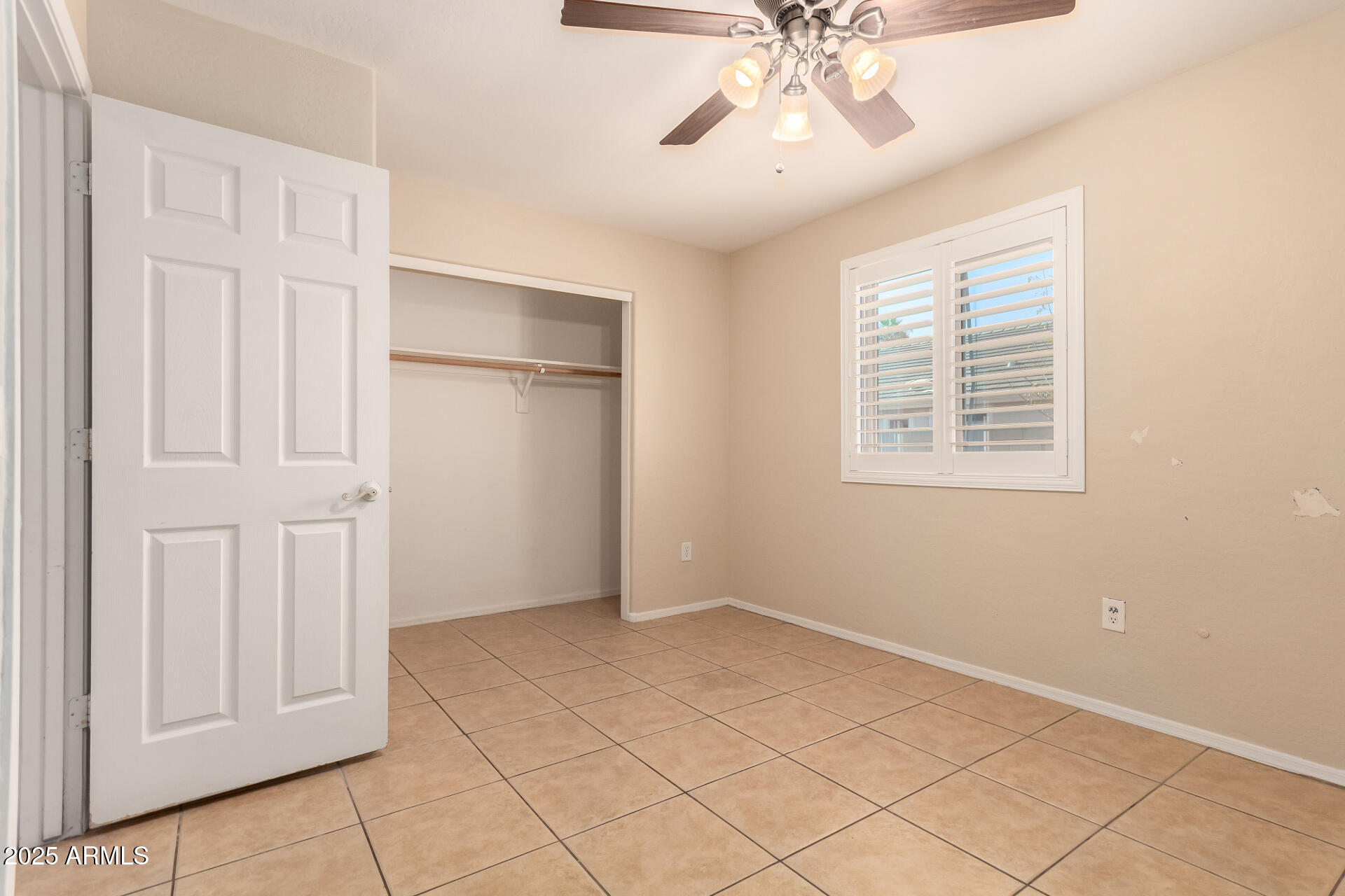 2513 West Carter Road Phoenix, AZ 85041 - Photo 18 of 27 a view of an empty room with a window