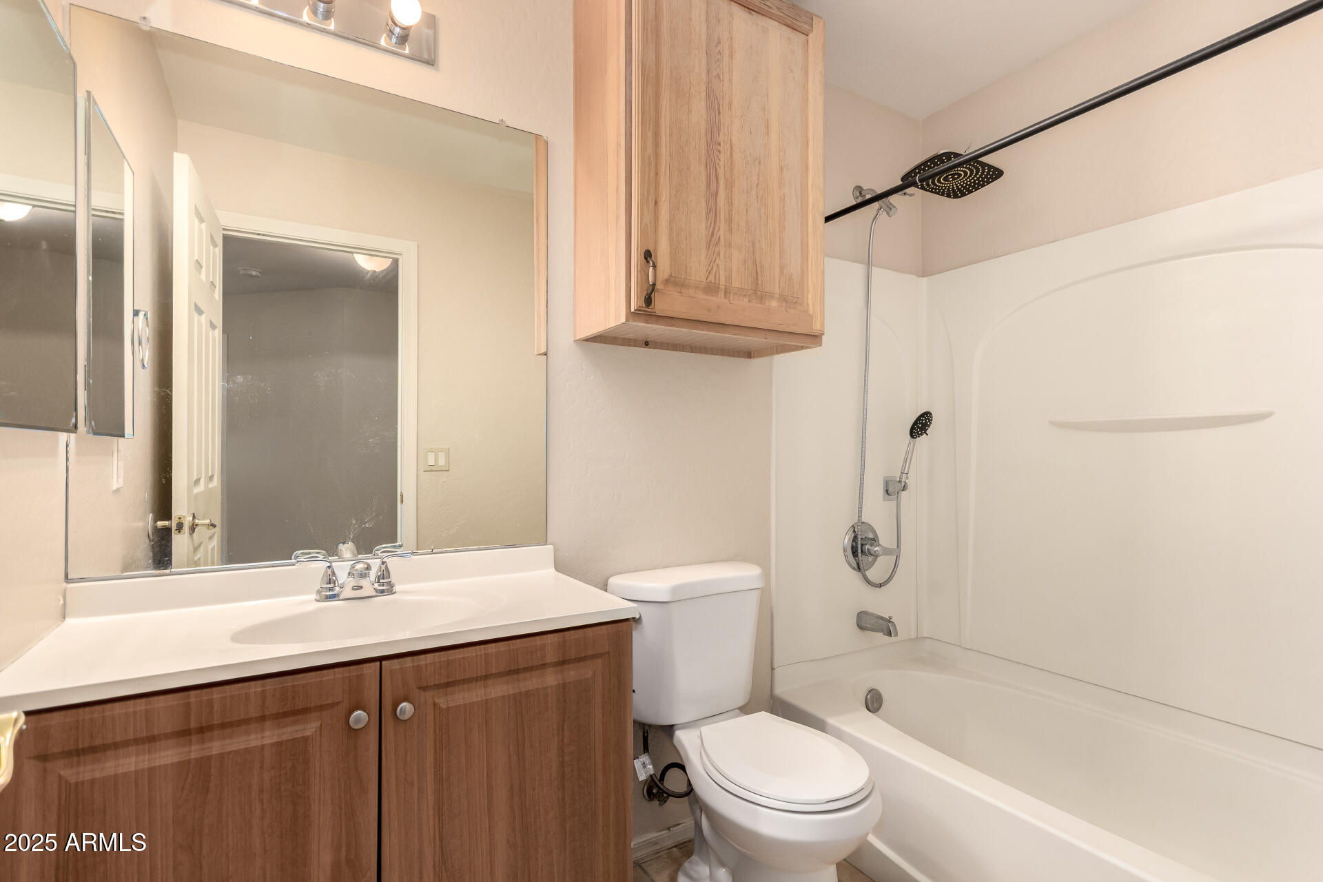 2513 West Carter Road Phoenix, AZ 85041 - Photo 20 of 27 a bathroom with a granite countertop sink a toilet and shower