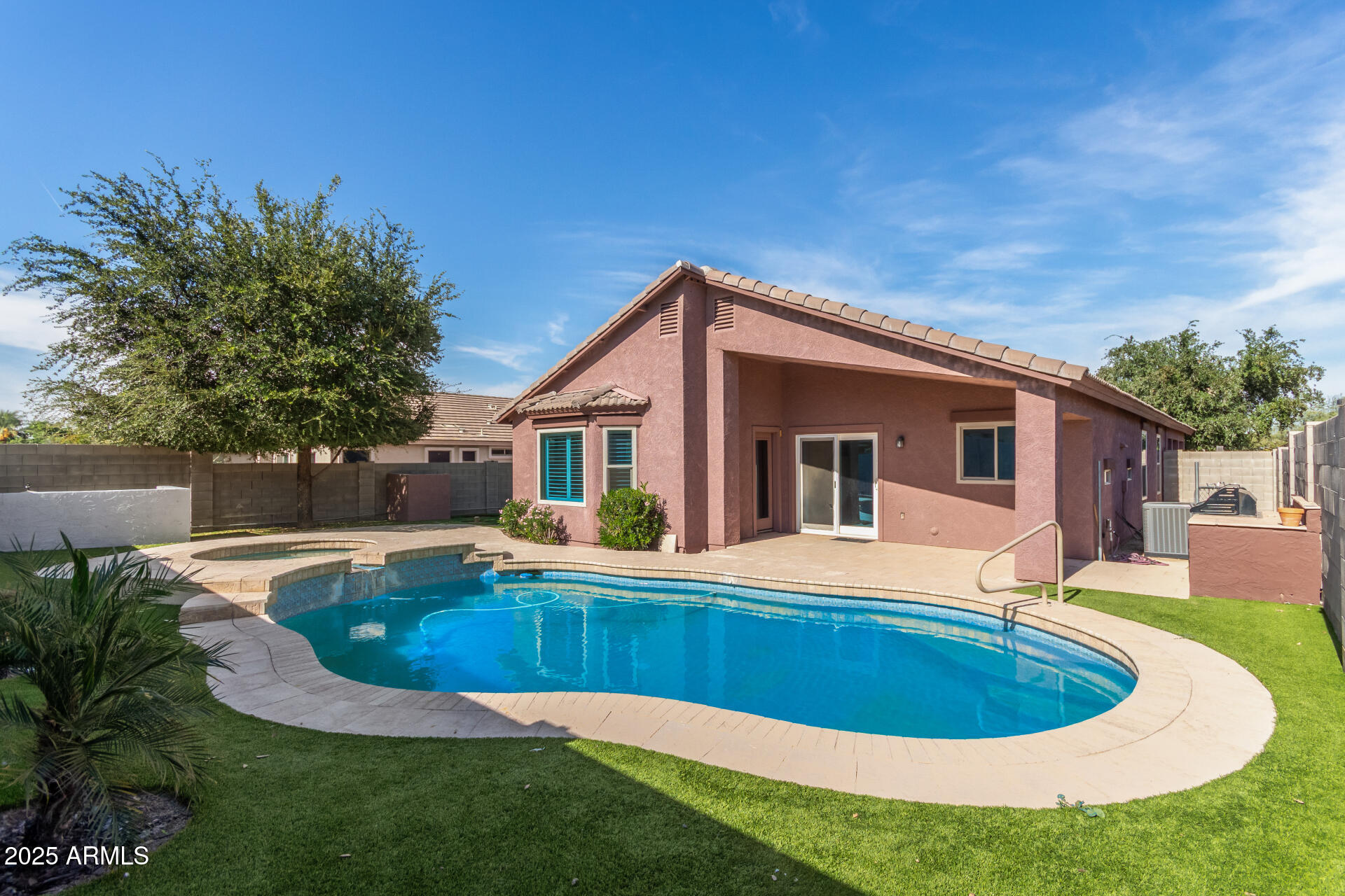 2513 West Carter Road Phoenix, AZ 85041 - Photo 24 of 27 a view of a house with a swimming pool
