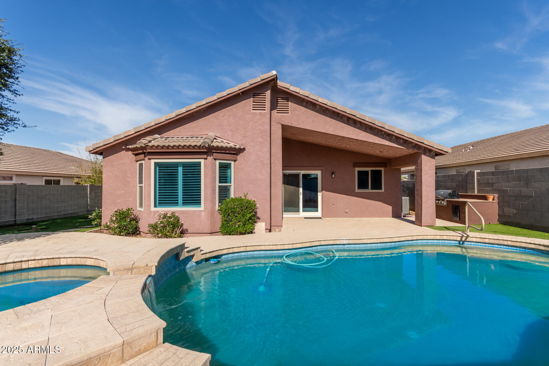 2513 West Carter Road Phoenix, AZ 85041 - Photo 6 of 27 a front view of a house with swimming pool