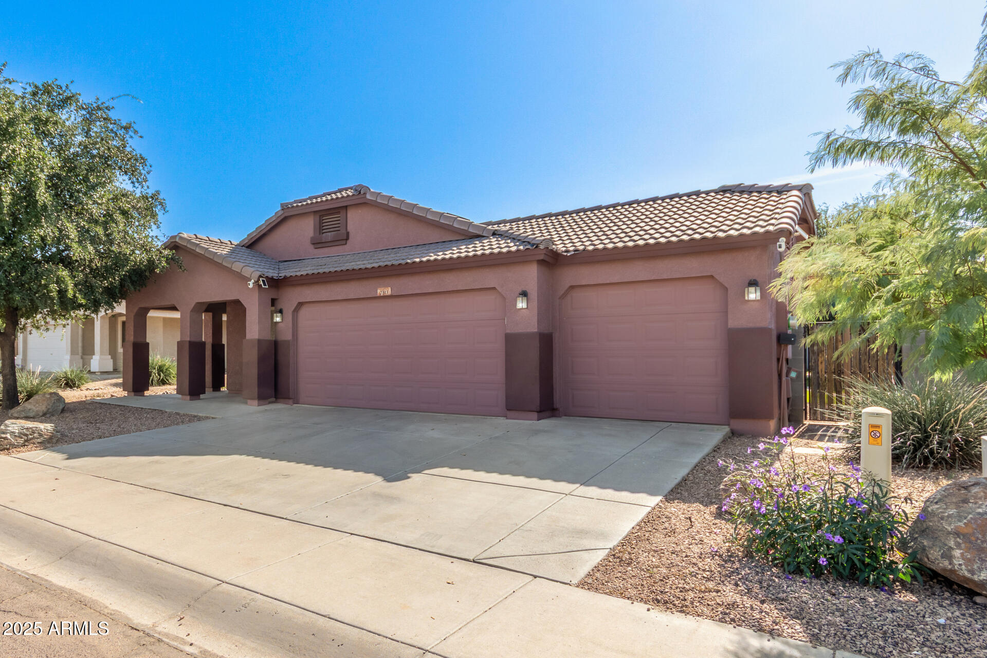 2513 West Carter Road Phoenix, AZ 85041 - Photo 8 of 27 a front view of a house with a yard and garage