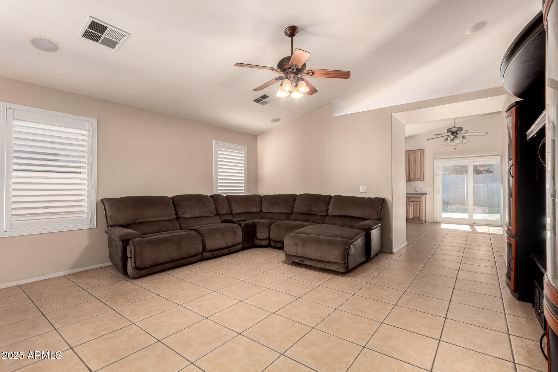 2513 West Carter Road Phoenix, AZ 85041 - Photo 9 of 27 a living room with furniture and a flat screen tv