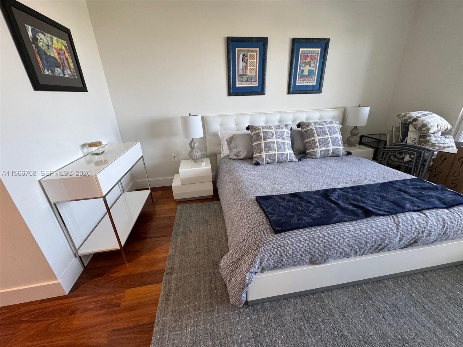 400 Alton Road, Unit 905 Miami Beach, FL 33139 - Photo 14 of 30 a living room with furniture and wooden floor