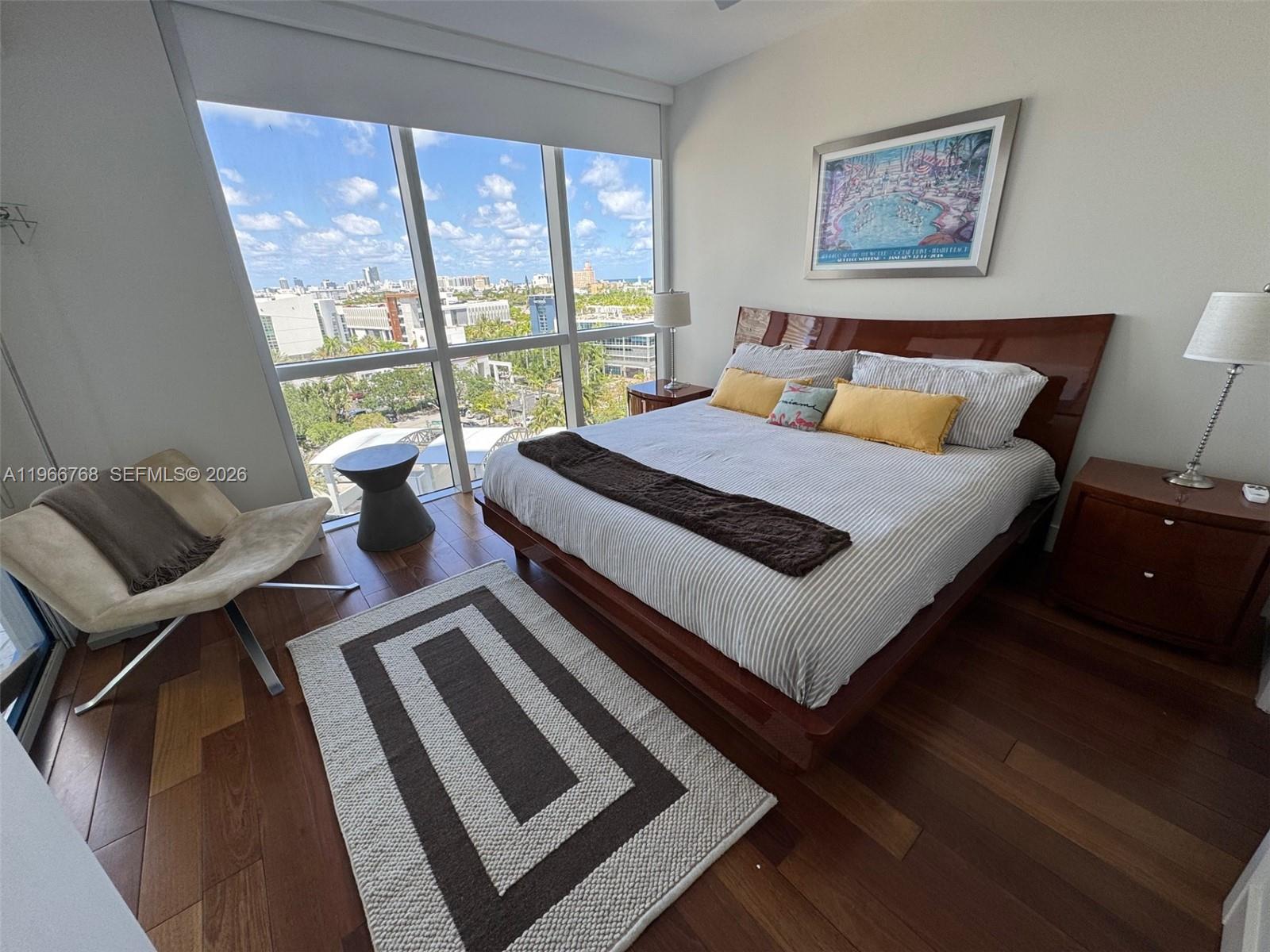 400 Alton Road, Unit 905 Miami Beach, FL 33139 - Photo 20 of 30 a bedroom with a bed and a large window