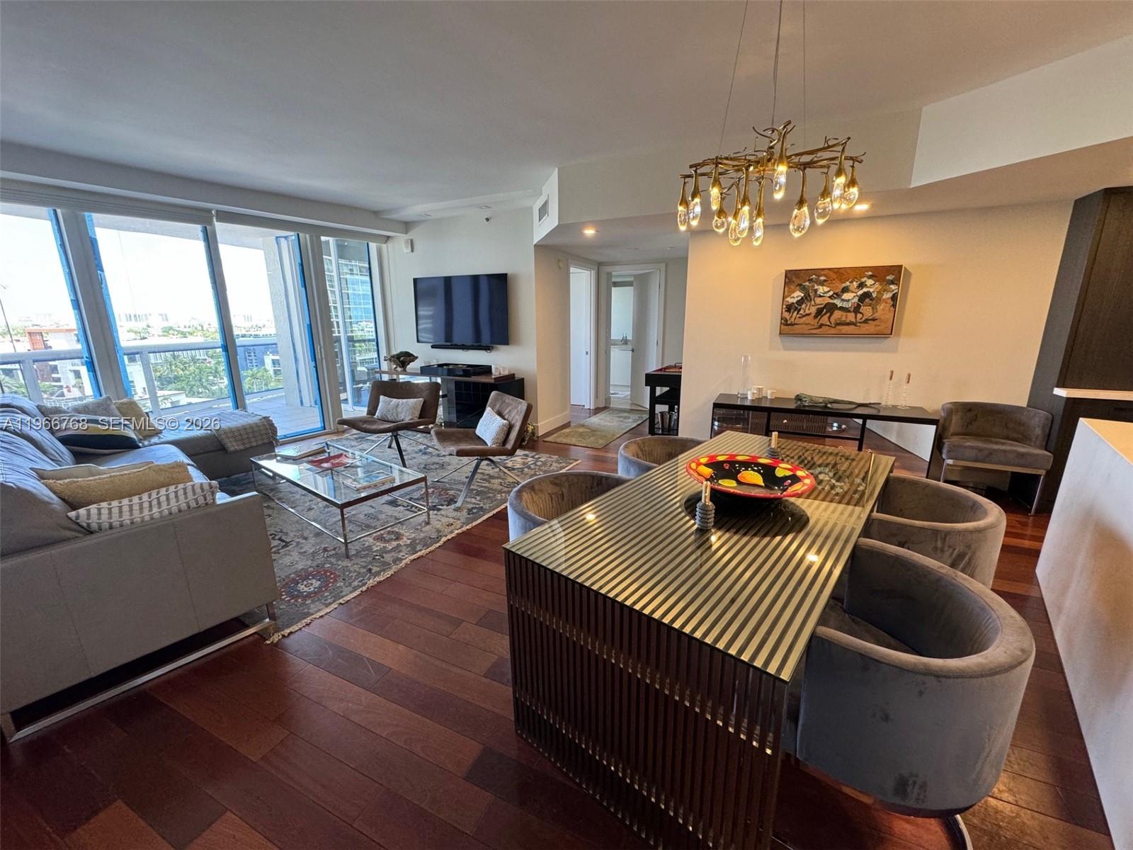 400 Alton Road, Unit 905 Miami Beach, FL 33139 - Photo 3 of 30 a living room with furniture or window and a table
