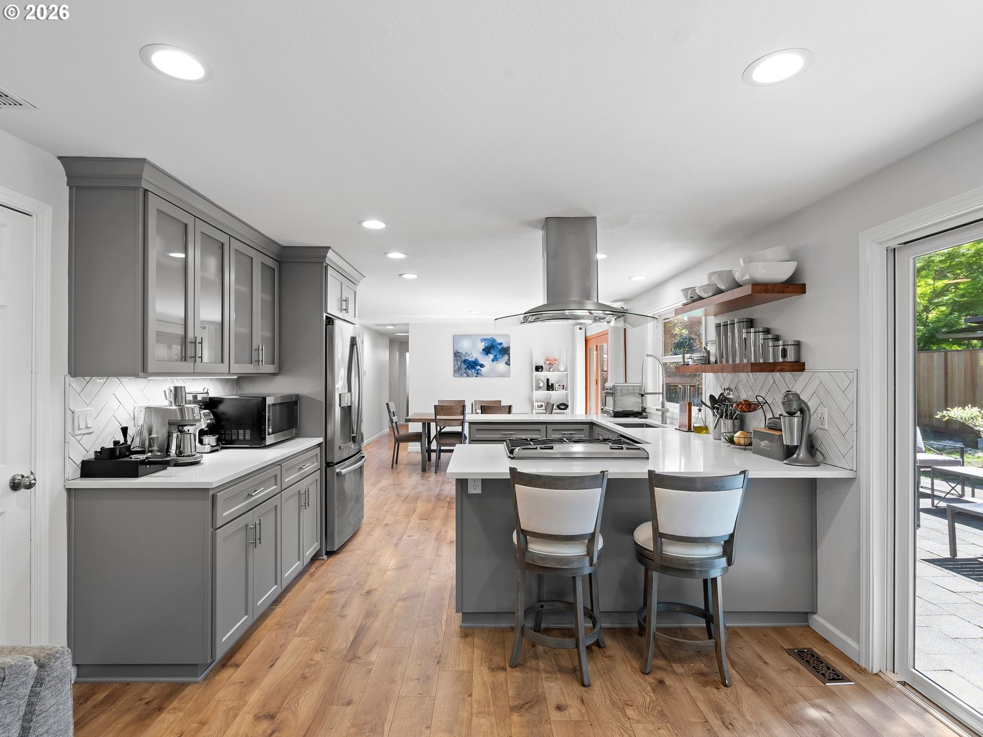 2615 Southwest 175th Avenue Beaverton, OR 97003 - Photo 11 of 42 a kitchen with a sink and chairs