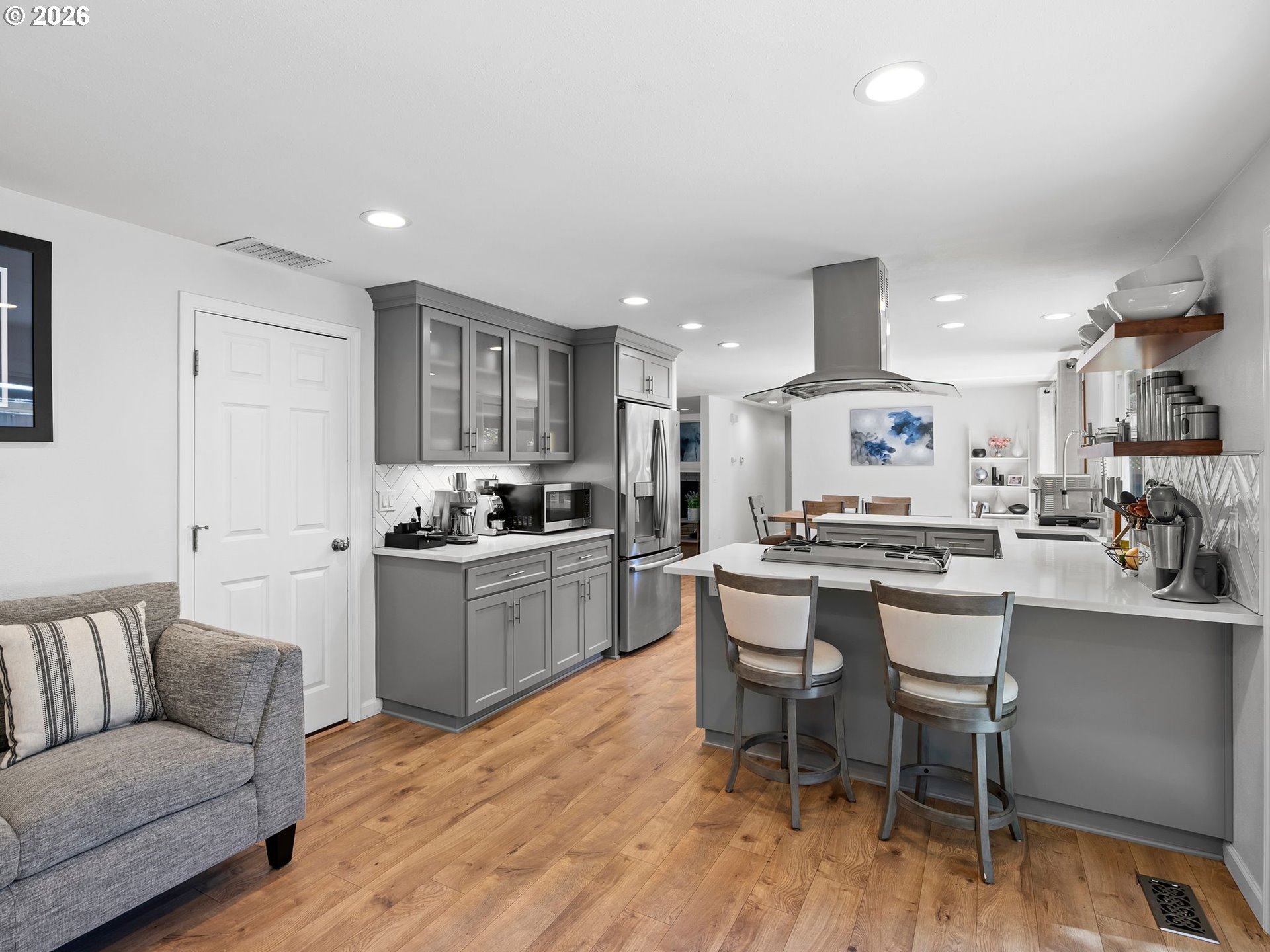 2615 Southwest 175th Avenue Beaverton, OR 97003 - Photo 14 of 42 a kitchen with a dining table chairs and wooden floor