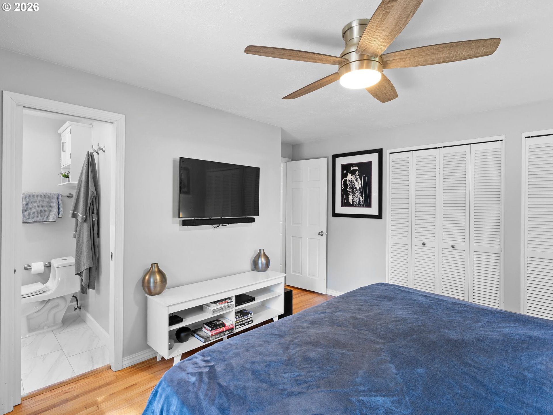 2615 Southwest 175th Avenue Beaverton, OR 97003 - Photo 21 of 42 a bedroom with a bed and a flat screen tv