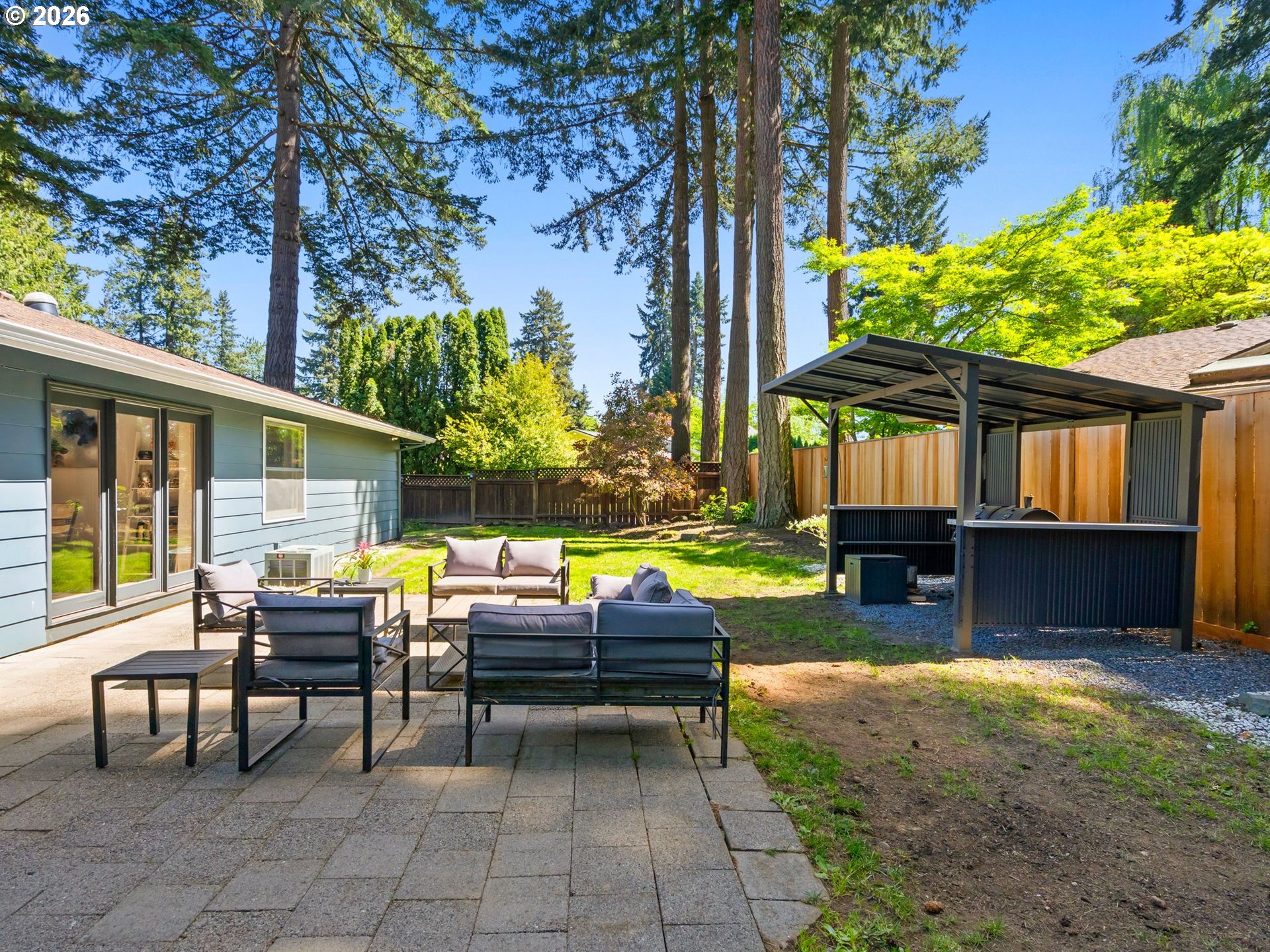 2615 Southwest 175th Avenue Beaverton, OR 97003 - Photo 31 of 42 a view of backyard of house with seating space
