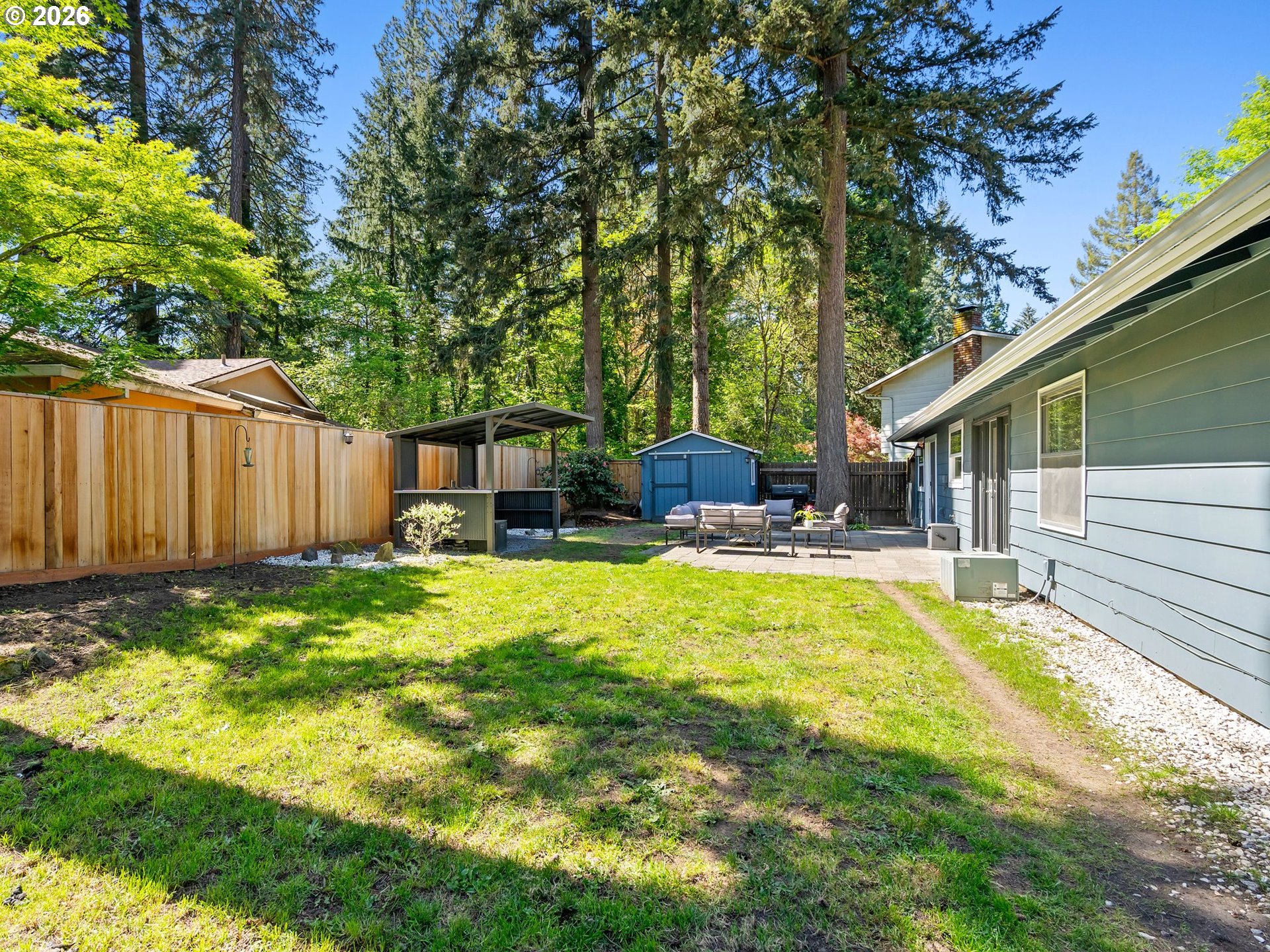 2615 Southwest 175th Avenue Beaverton, OR 97003 - Photo 32 of 42 a swimming pool with outdoor seating and yard
