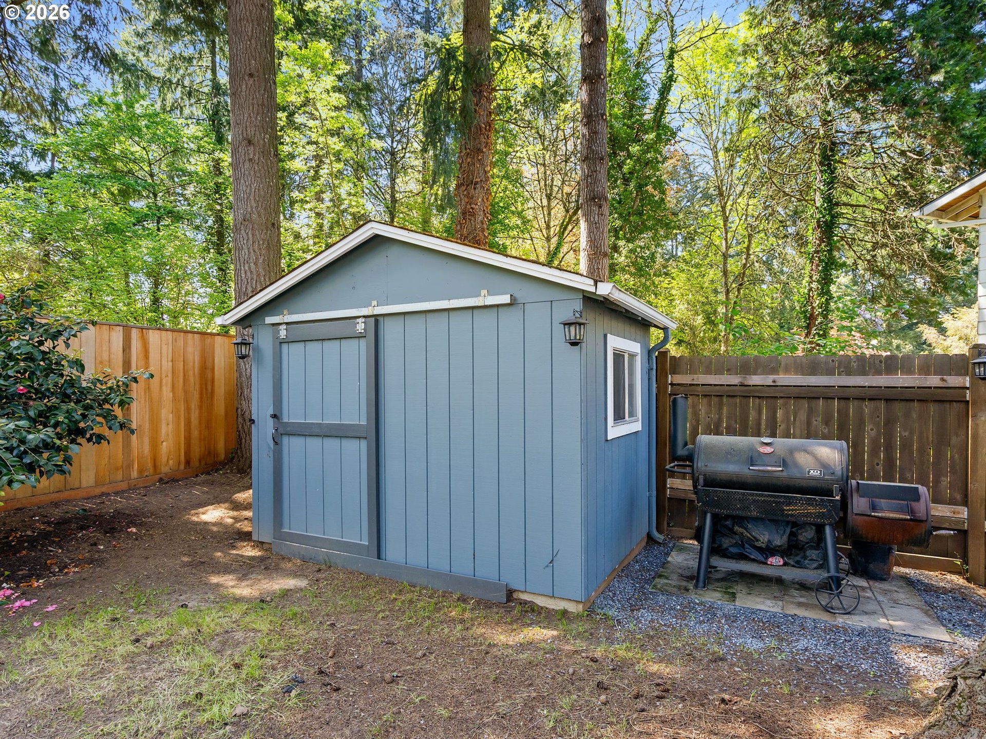 2615 Southwest 175th Avenue Beaverton, OR 97003 - Photo 34 of 42 a backyard of a house with barbeque oven and outdoor seating