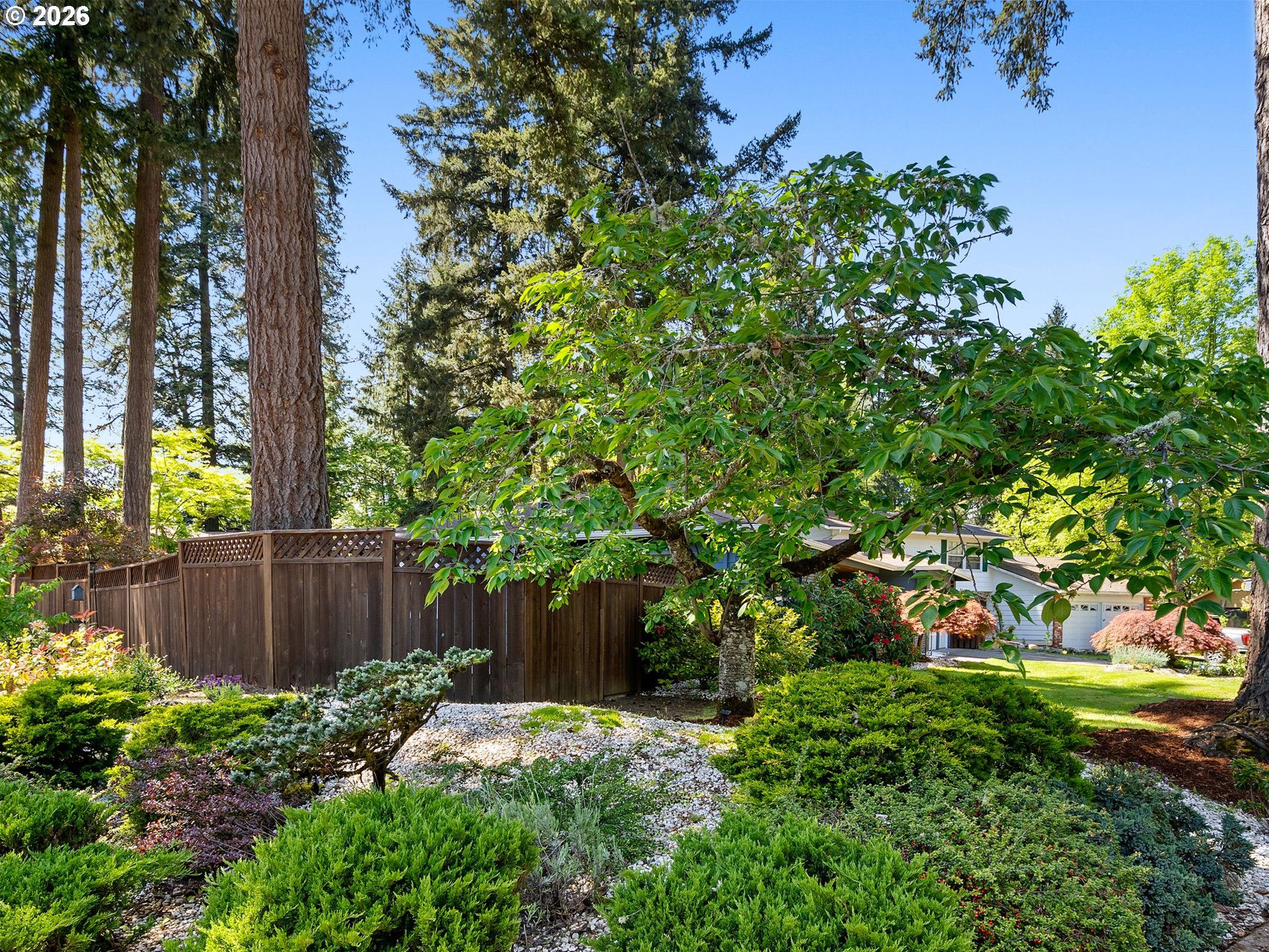 2615 Southwest 175th Avenue Beaverton, OR 97003 - Photo 41 of 42 a backyard of a house with lots of green space