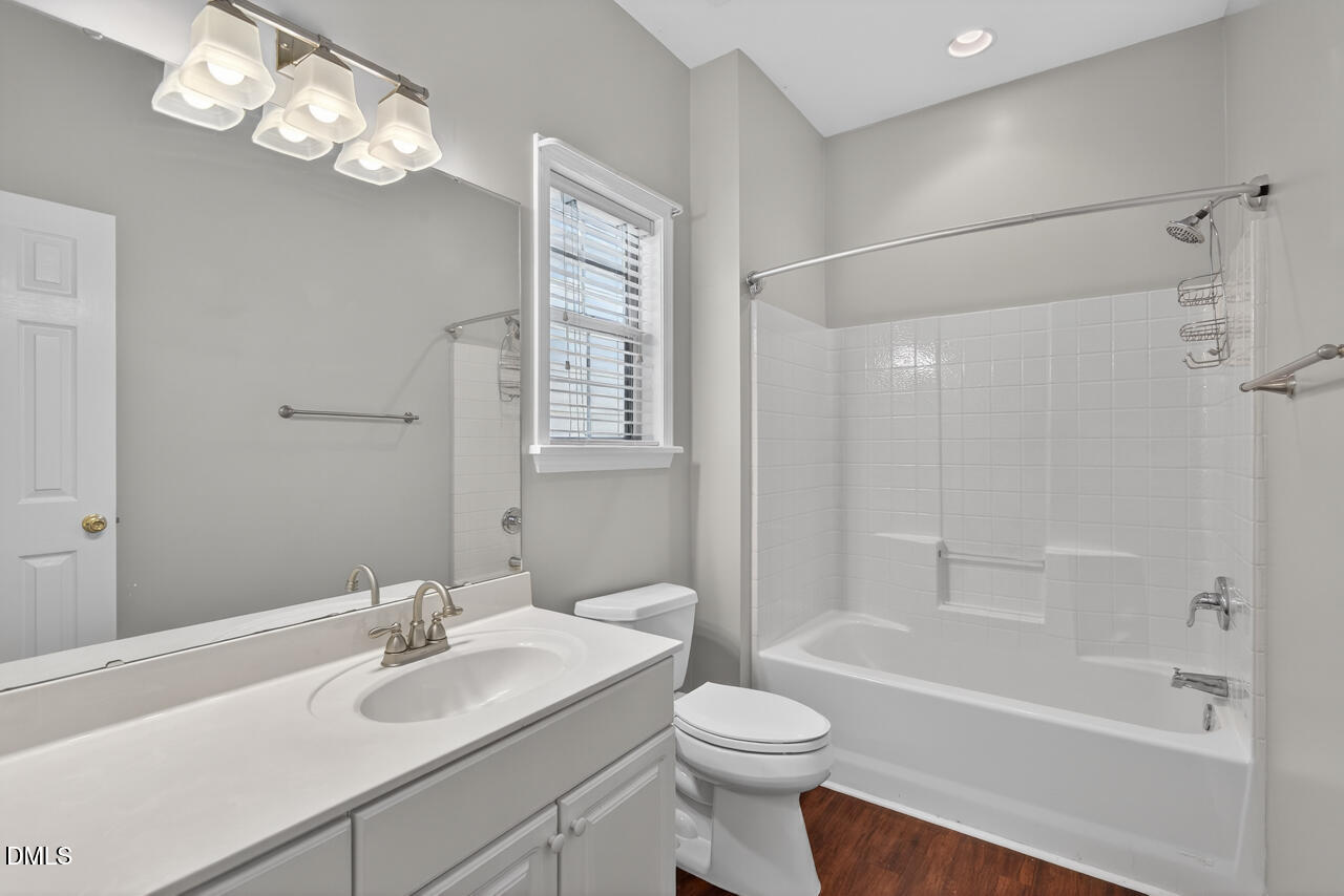 5325 Bartram Place Raleigh, NC 27617 - Photo 24 of 31 a bathroom with a sink a toilet and a bathtub