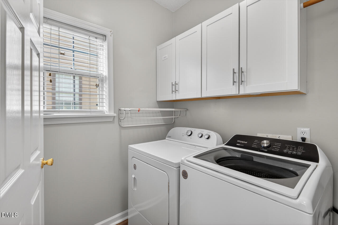 5325 Bartram Place Raleigh, NC 27617 - Photo 25 of 31 a view of storage and utility room with washer and dryer