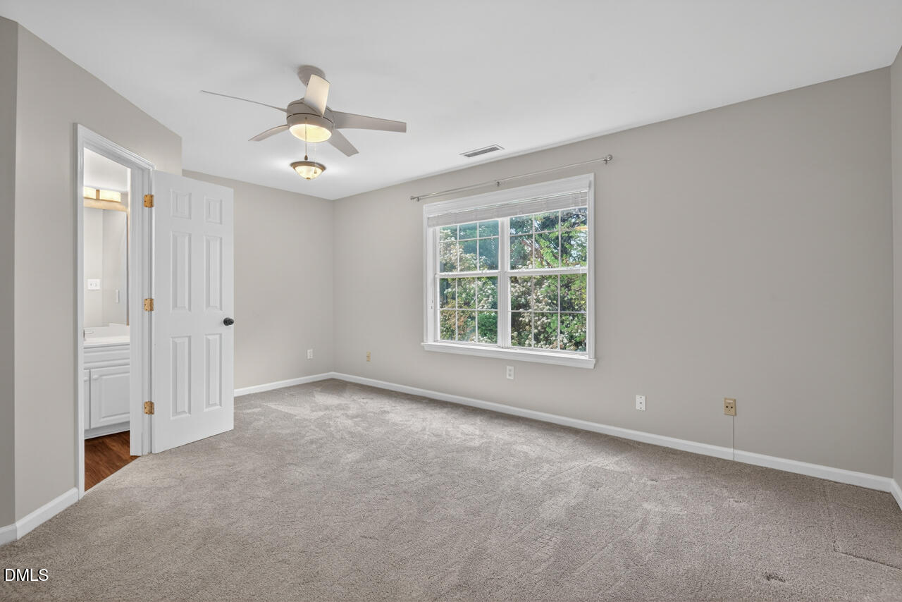 5325 Bartram Place Raleigh, NC 27617 - Photo 26 of 31 an empty room with fan and windows
