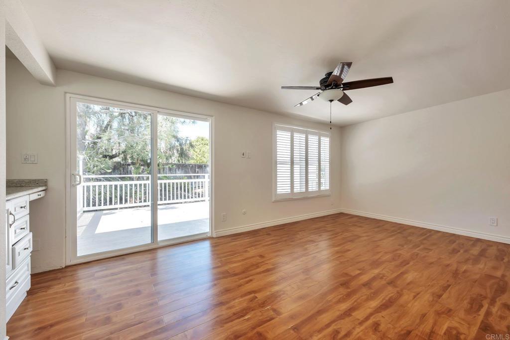 2128 Mountain Vista Drive Encinitas, CA 92024 - Photo 11 of 25 a view of empty room with wooden floor and fan