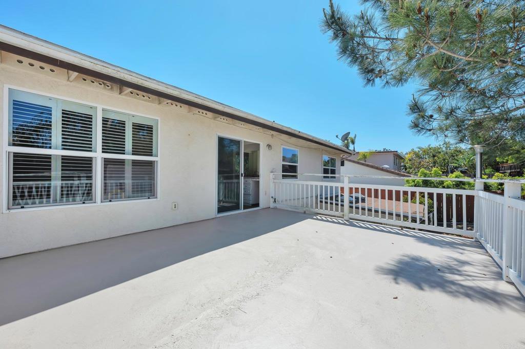 2128 Mountain Vista Drive Encinitas, CA 92024 - Photo 14 of 25 a view of a house with deck and a yard