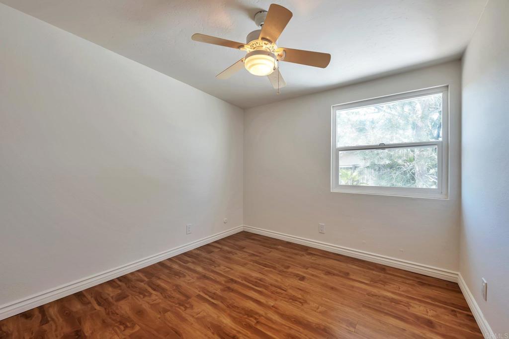 2128 Mountain Vista Drive Encinitas, CA 92024 - Photo 17 of 25 wooden floor in an empty room with a window