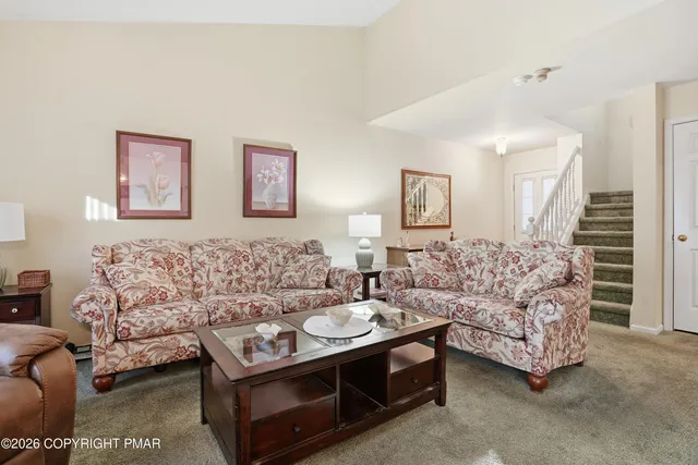 a living room with furniture and a couch