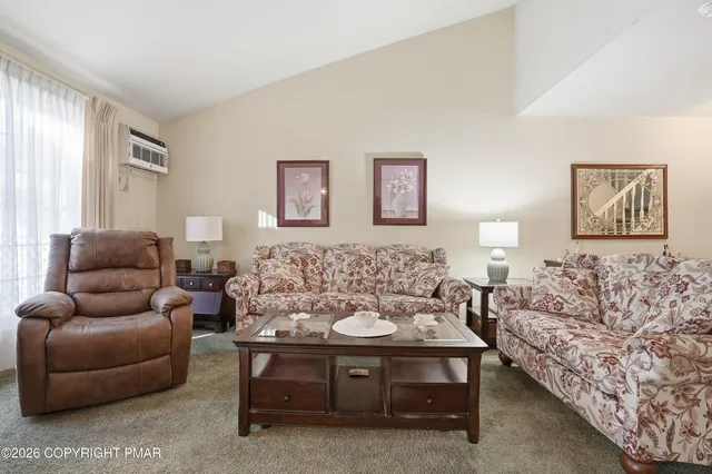 a living room with furniture and a couch