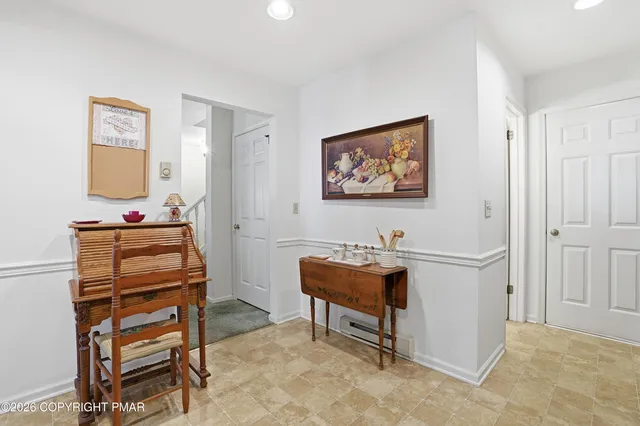 a view of a workspace with furniture