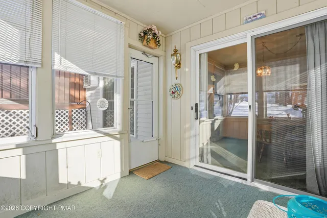 a view of a room with a large window