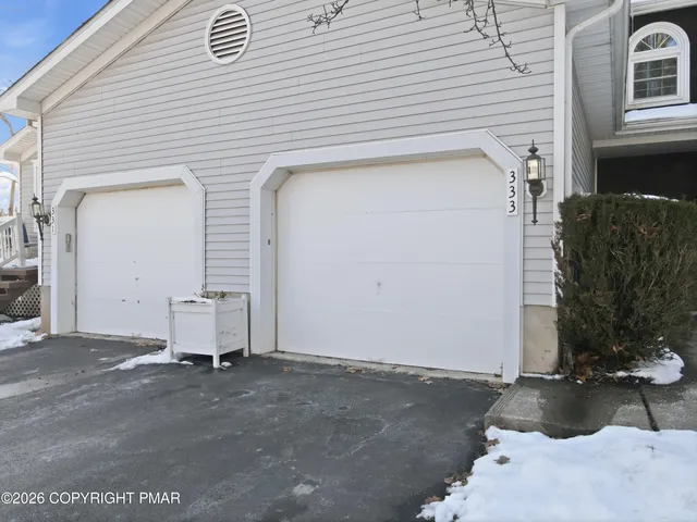 a front view of a house with a garage