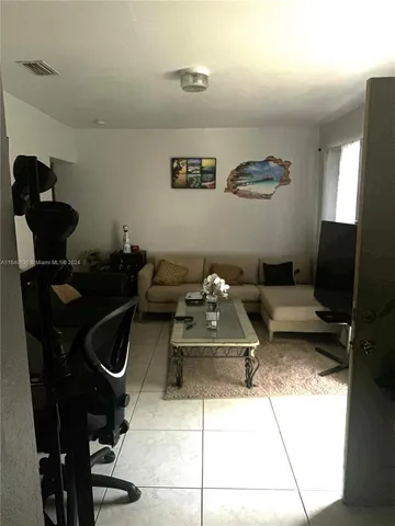 a kitchen with a sink a stove a microwave and cabinets