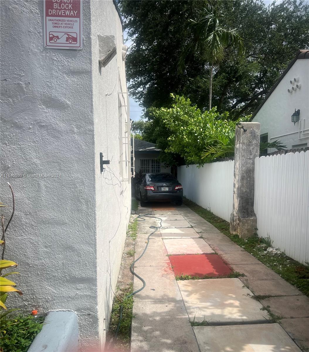 655 Northeast 80th Street Miami, FL 33138 - Photo 4 of 19 a view of path along with building