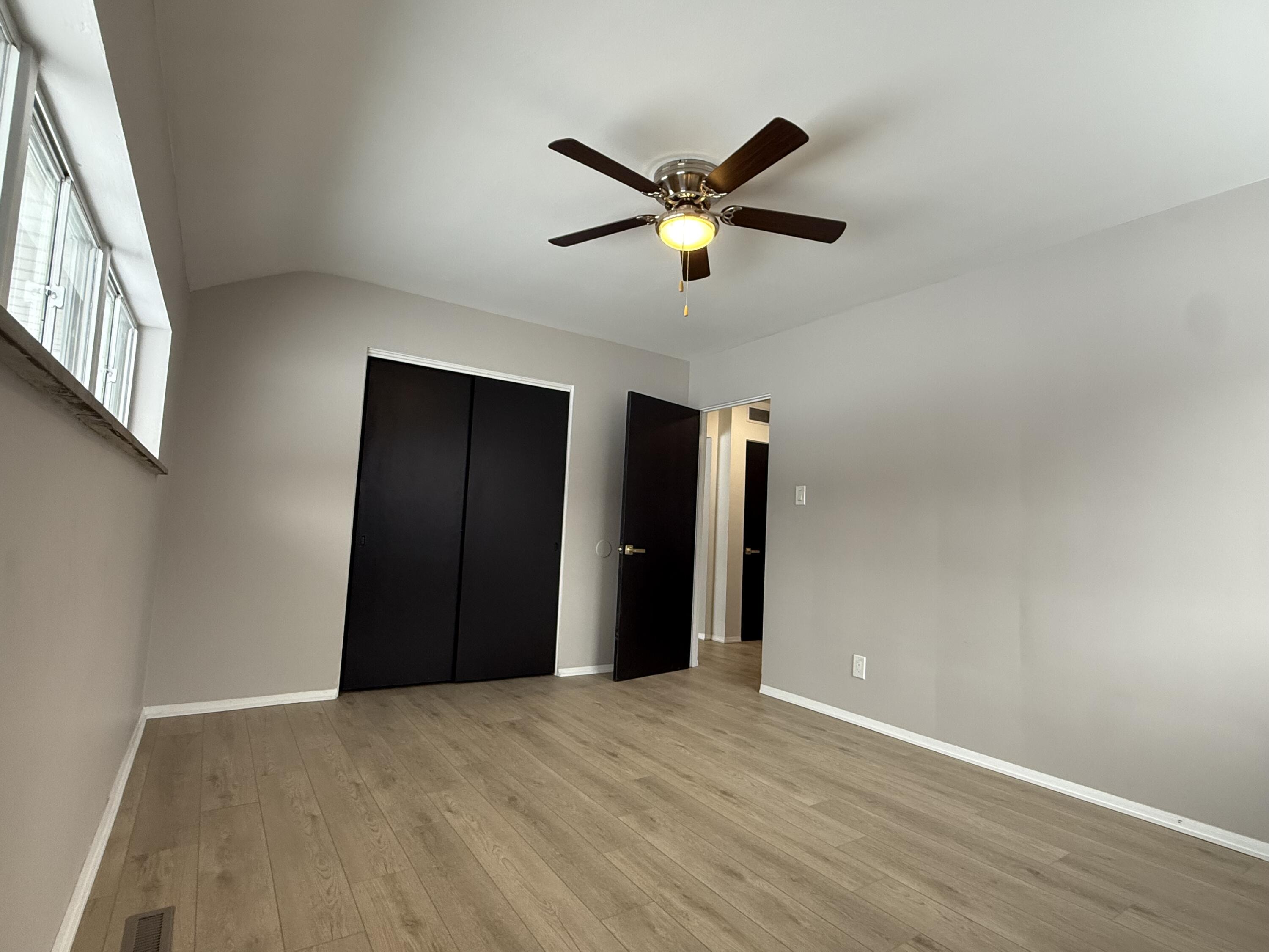 7008 Baring Avenue Hammond, IN 46324 - Photo 14 of 22 a view of a livingroom with a ceiling fan and window