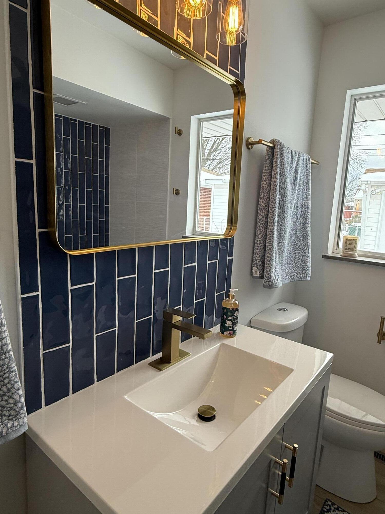 7008 Baring Avenue Hammond, IN 46324 - Photo 15 of 22 a bathroom with a sink and a mirror