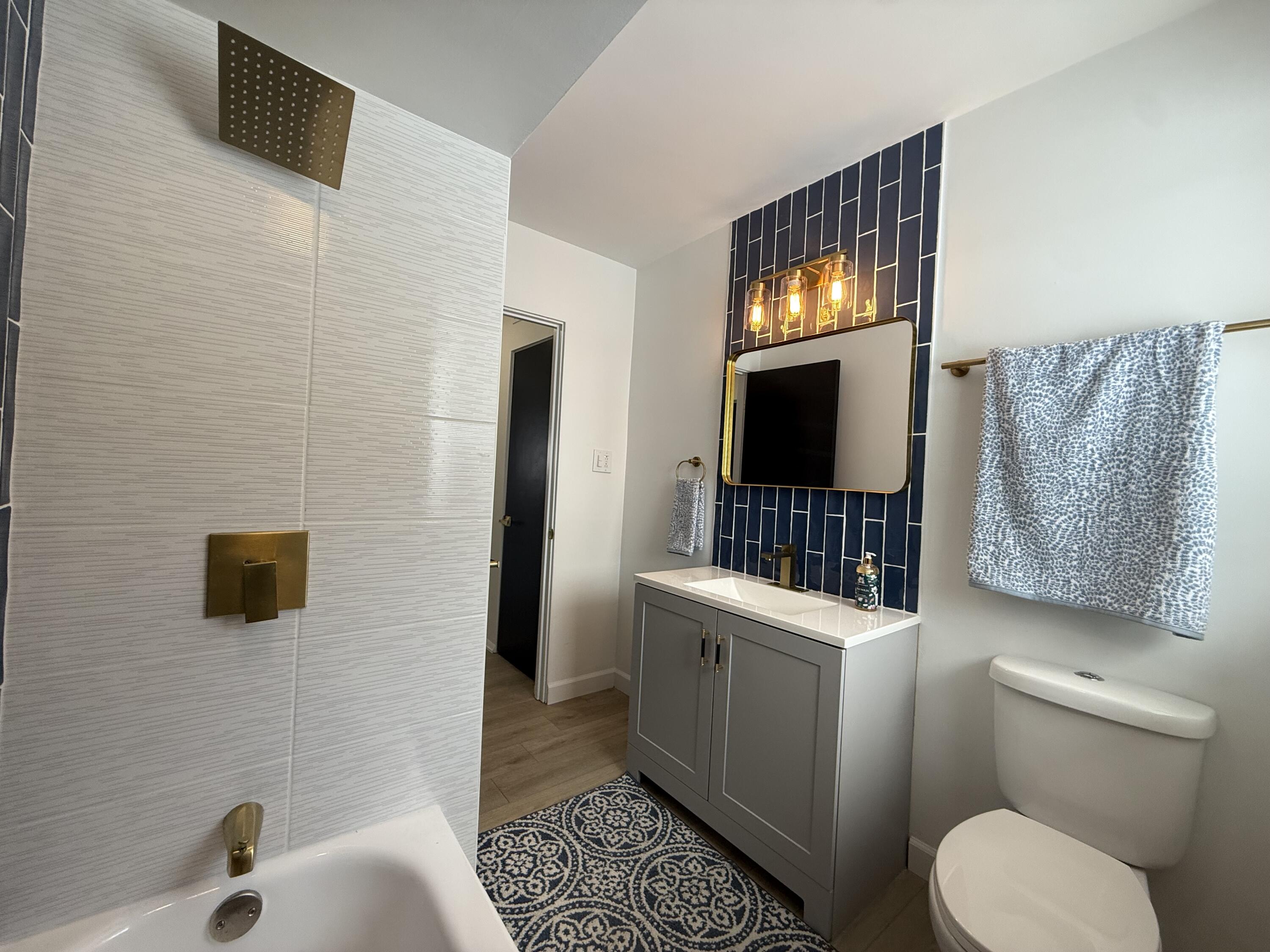 7008 Baring Avenue Hammond, IN 46324 - Photo 16 of 22 a bathroom with a toilet sink and mirror