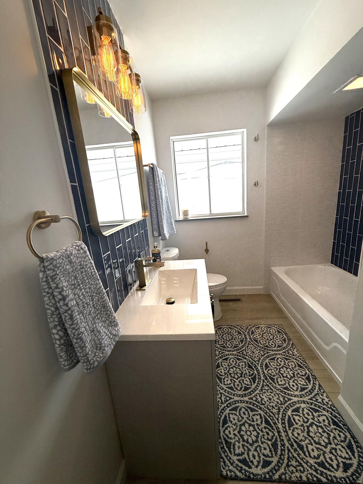 7008 Baring Avenue Hammond, IN 46324 - Photo 17 of 22 a bathroom with a sink a toilet and a mirror