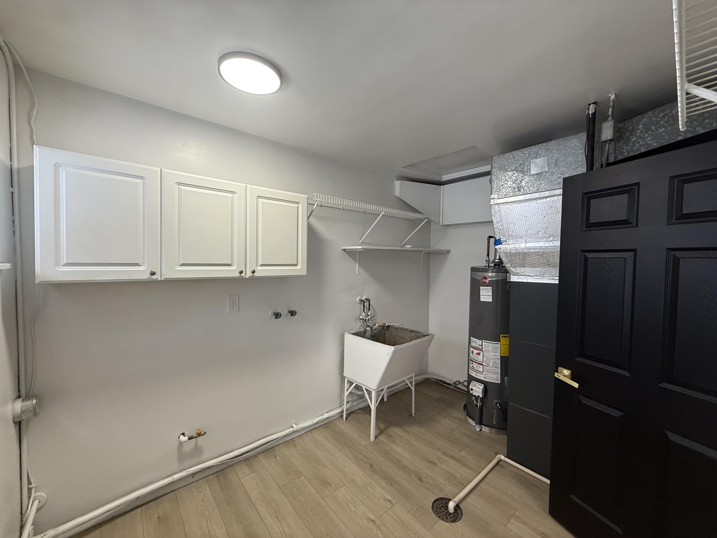 7008 Baring Avenue Hammond, IN 46324 - Photo 20 of 22 a room with cabinets and wooden floor