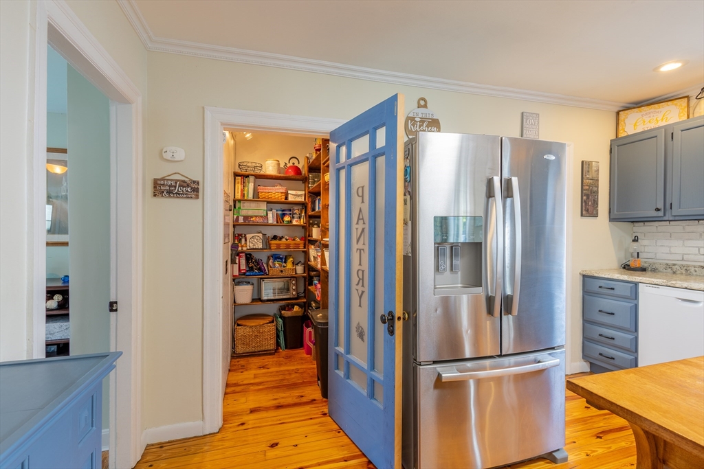 137 Papineau Avenue Woonsocket, RI 02895 - Photo 12 of 33 a kitchen with stainless steel appliances granite countertop a refrigerator and a stove top oven