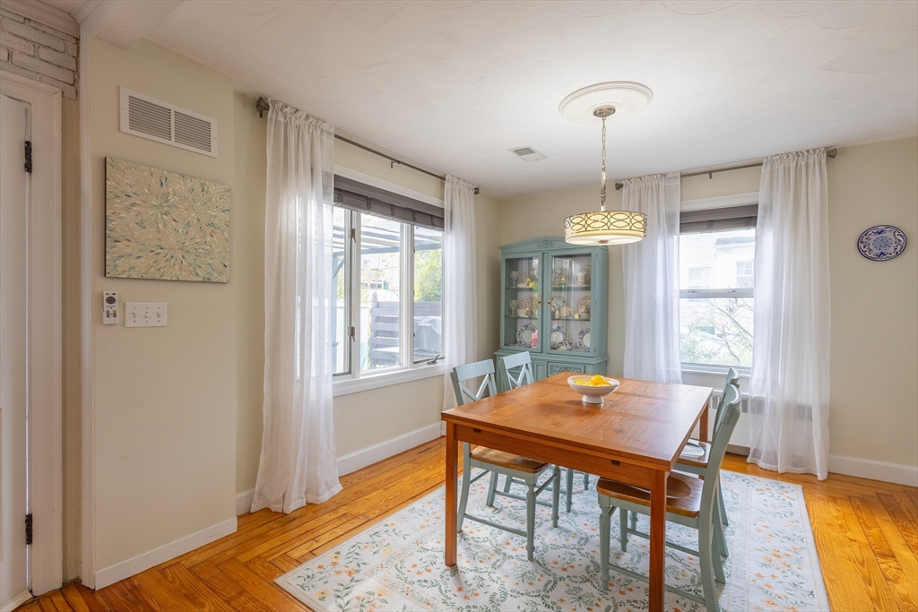 137 Papineau Avenue Woonsocket, RI 02895 - Photo 13 of 33 a view of a dining room with furniture window and wooden floor