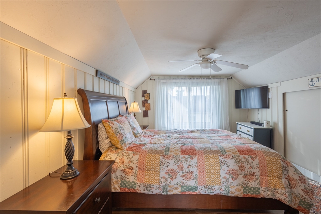 137 Papineau Avenue Woonsocket, RI 02895 - Photo 16 of 33 a bedroom with a bed and a flat tv screen on the dresser