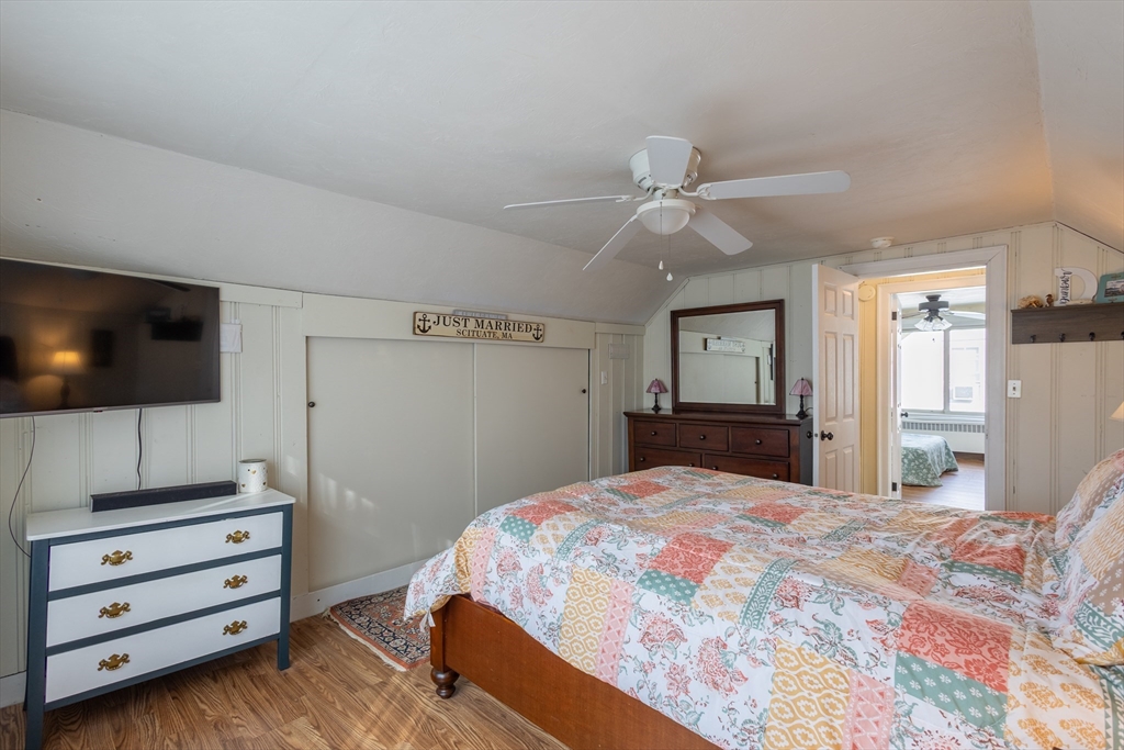 137 Papineau Avenue Woonsocket, RI 02895 - Photo 18 of 33 a bedroom with a bed and a flat screen tv