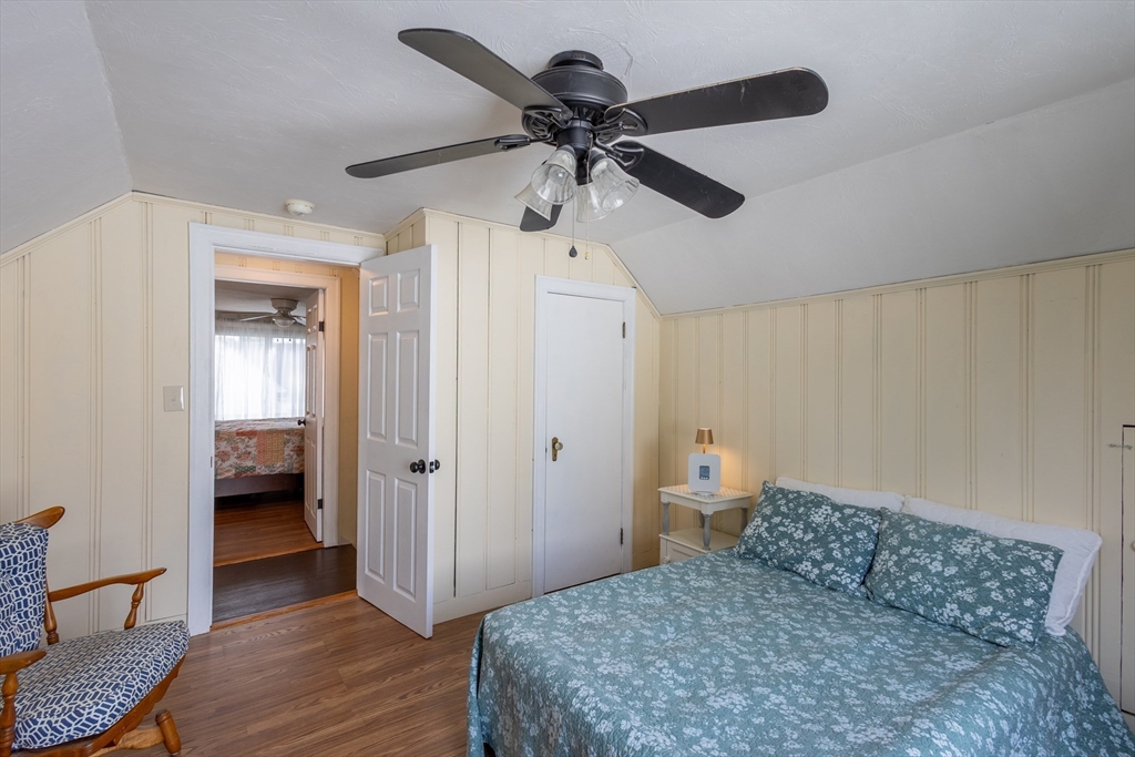 137 Papineau Avenue Woonsocket, RI 02895 - Photo 20 of 33 a bedroom with a bed and a chandelier