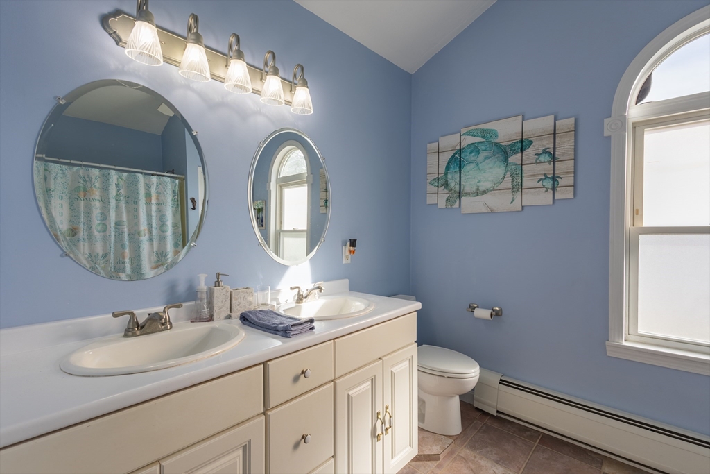 137 Papineau Avenue Woonsocket, RI 02895 - Photo 21 of 33 a bathroom with 2 sink and a mirror