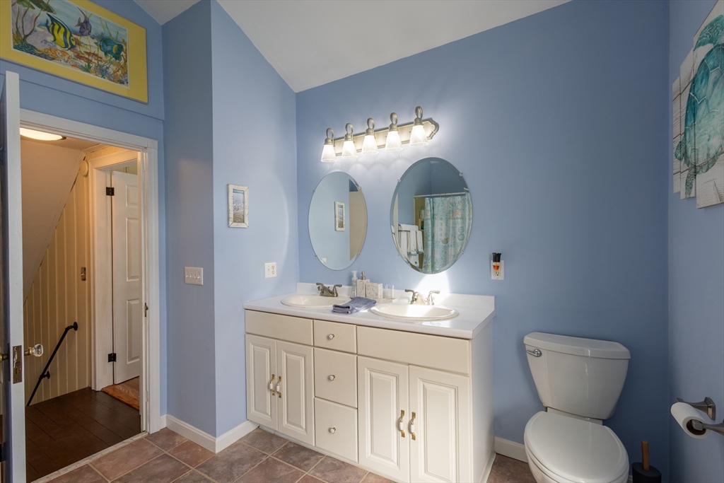 137 Papineau Avenue Woonsocket, RI 02895 - Photo 22 of 33 a bathroom with a toilet sink and mirror