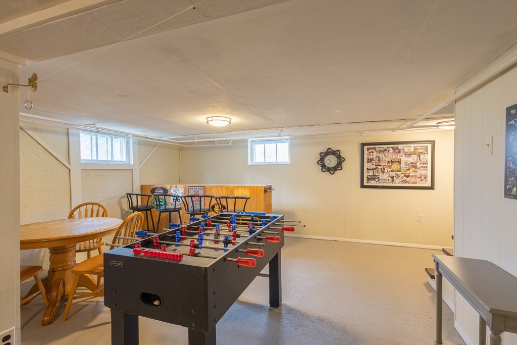 137 Papineau Avenue Woonsocket, RI 02895 - Photo 28 of 33 a view of a dining room with furniture and a chandelier