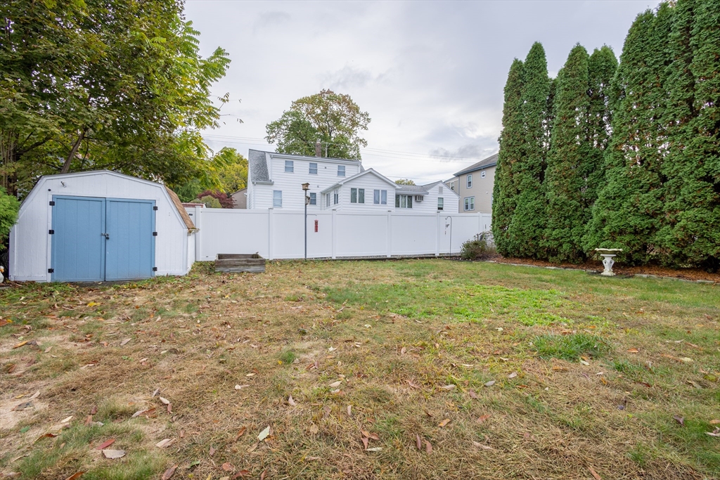137 Papineau Avenue Woonsocket, RI 02895 - Photo 32 of 33 front view of a house with a yard