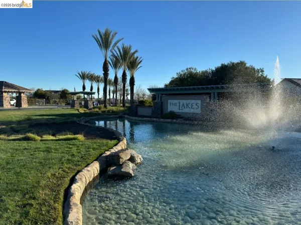 a view of a lake with a house in the background