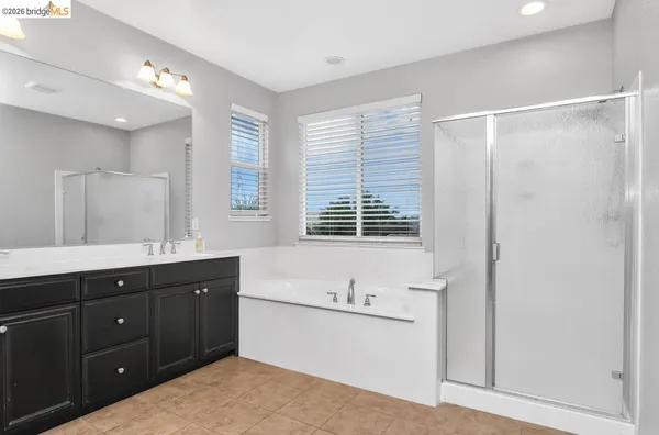 a bathroom with a sink a vanity and a mirror