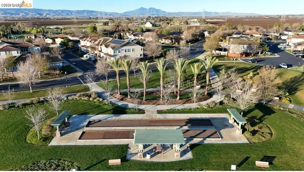 a front view of a house with a yard table and chairs