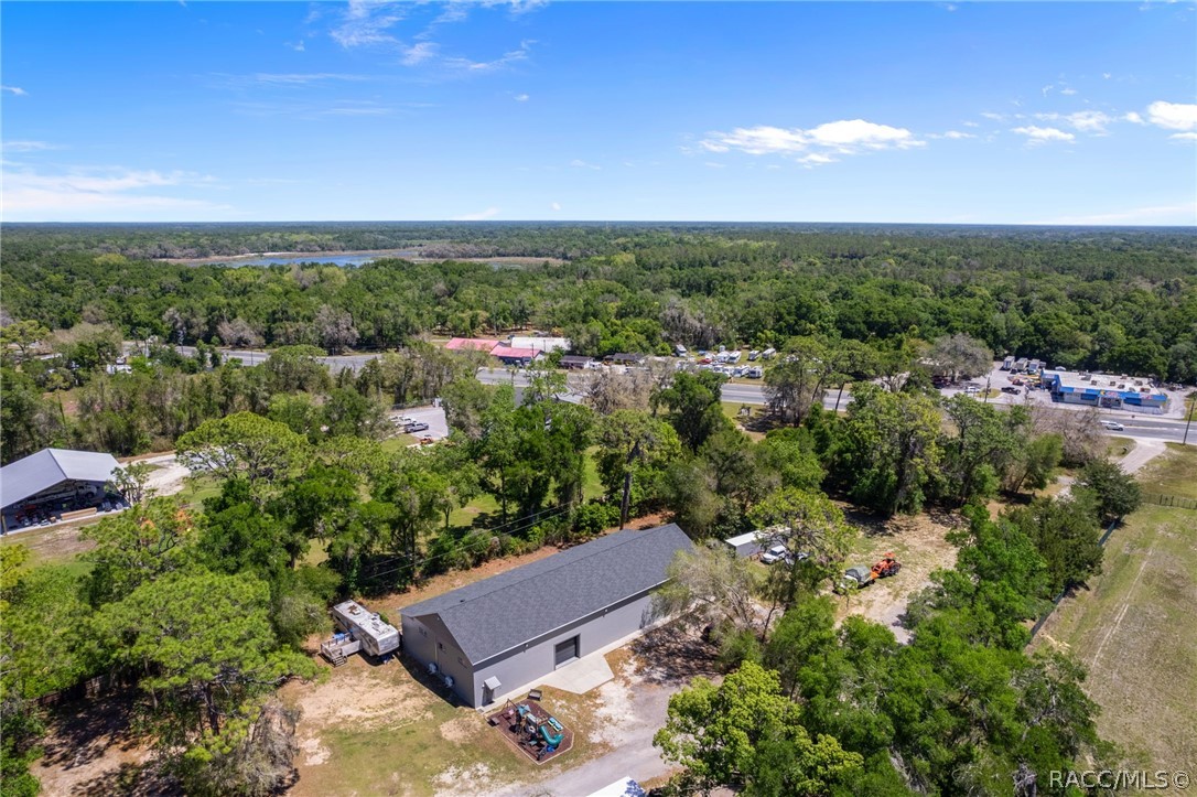 4530 South Florida Avenue Inverness, FL 34450 - Photo 93 of 100 an aerial view of a house with a yard and lake view in back