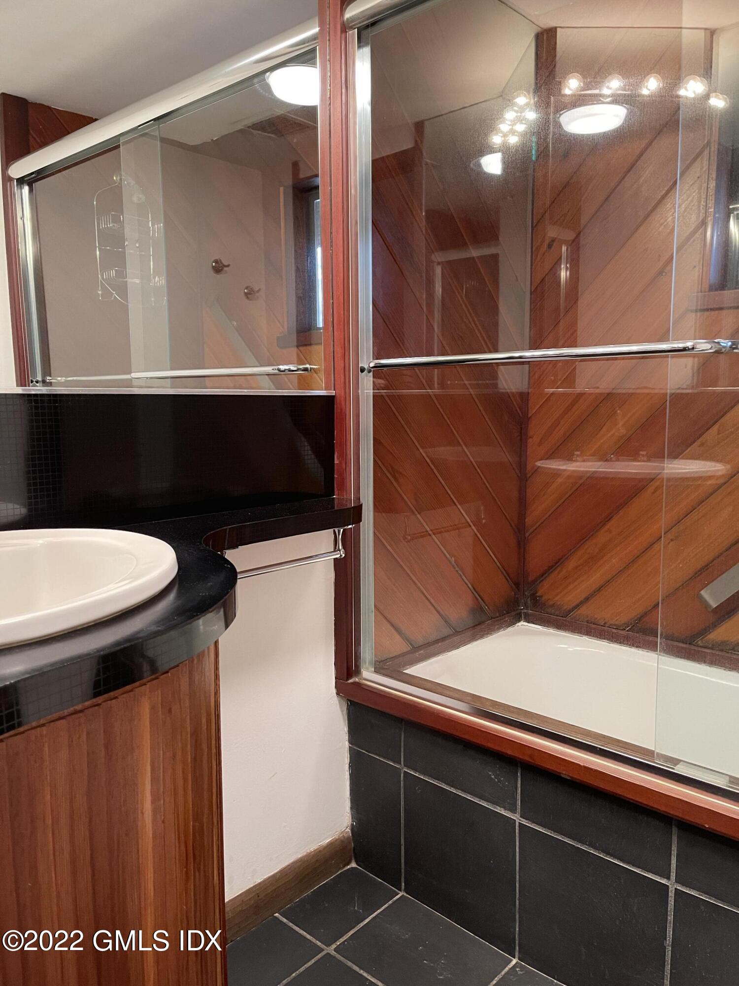 331 Stanwich Road Greenwich, CT 06830 - Photo 19 of 28 a bathroom with a sink a toilet and mirror