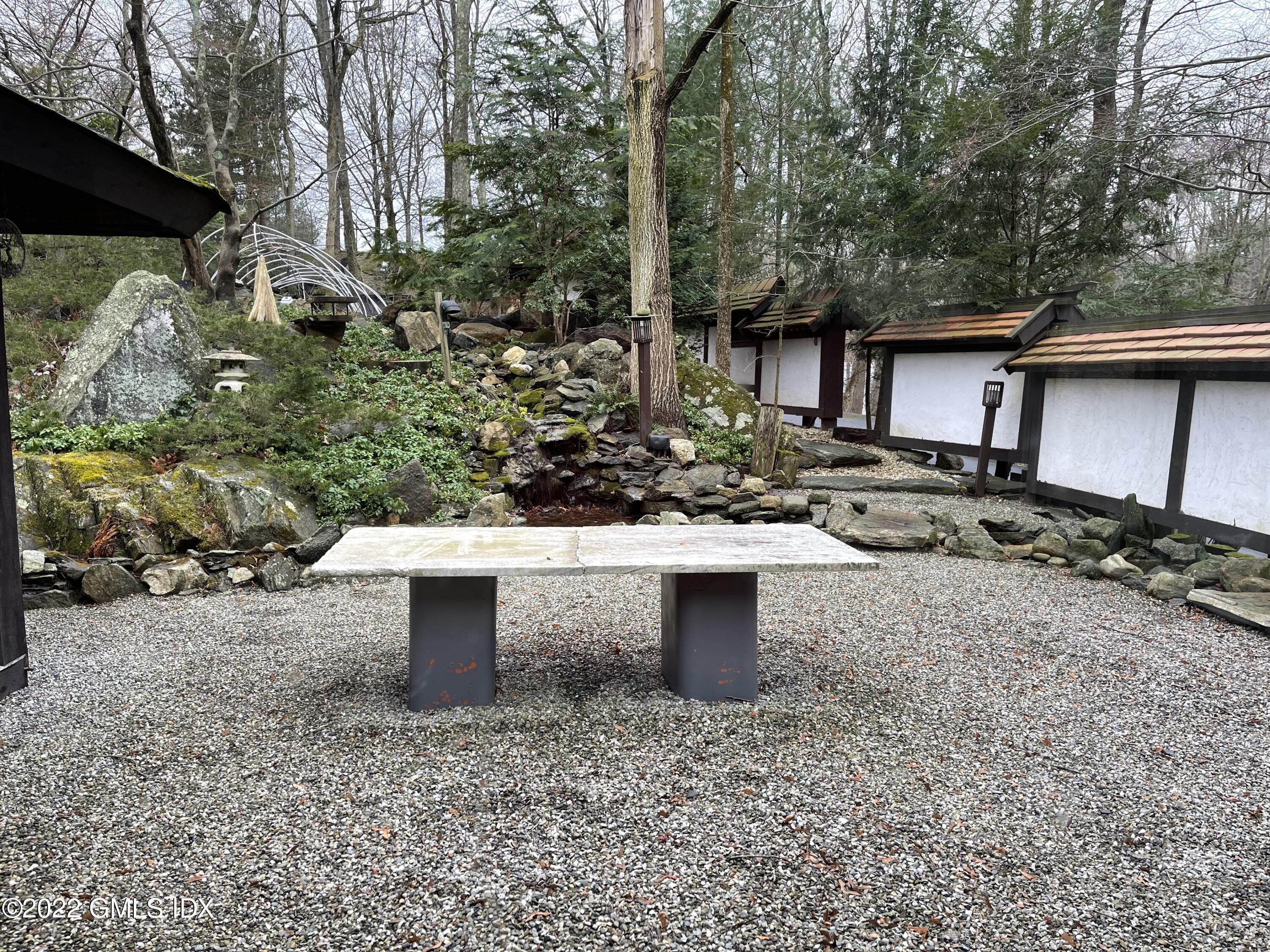 331 Stanwich Road Greenwich, CT 06830 - Photo 23 of 28 a view of a backyard that has plants and large tree