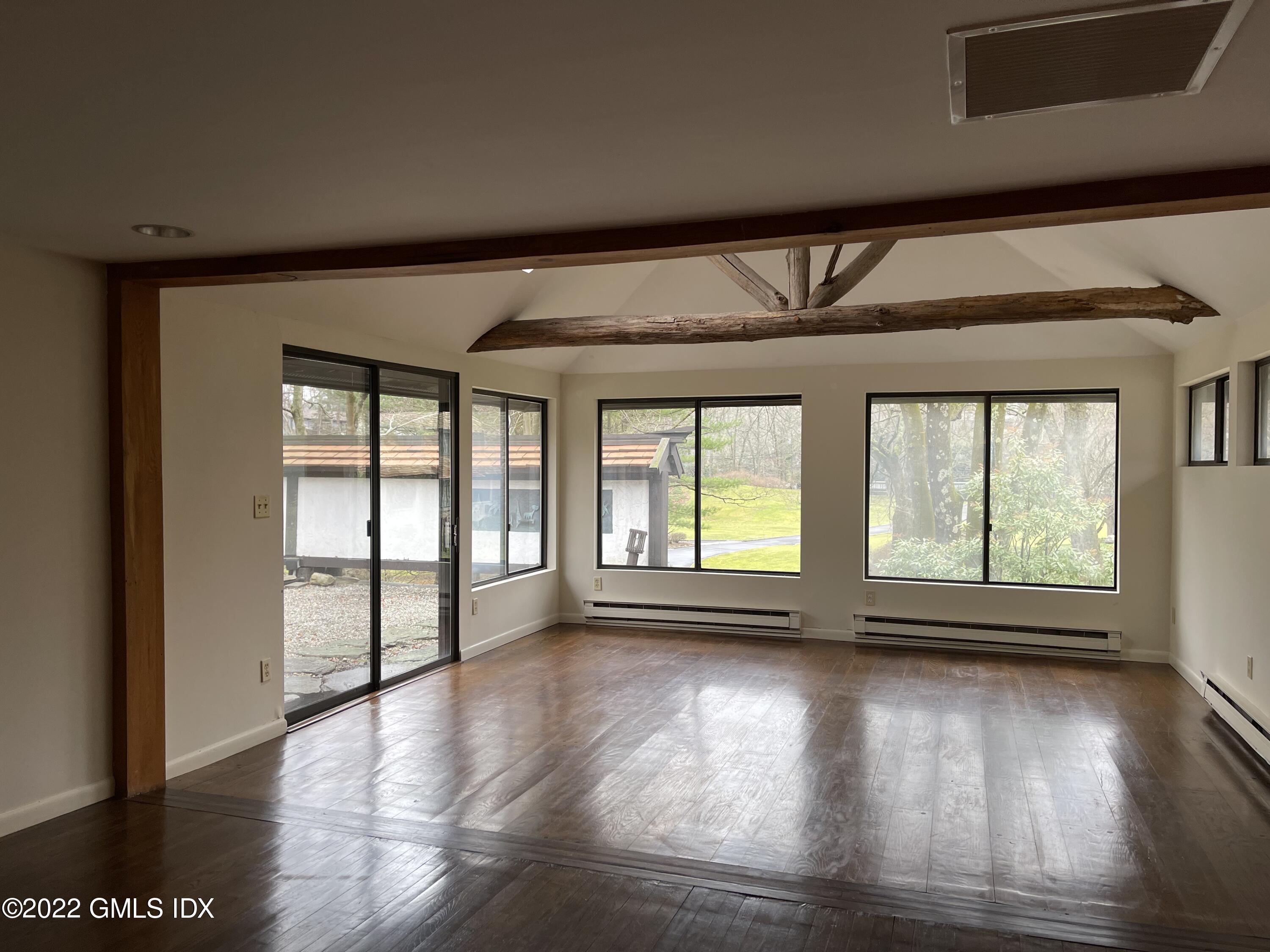 331 Stanwich Road Greenwich, CT 06830 - Photo 5 of 28 a view of empty room with wooden floor and fan